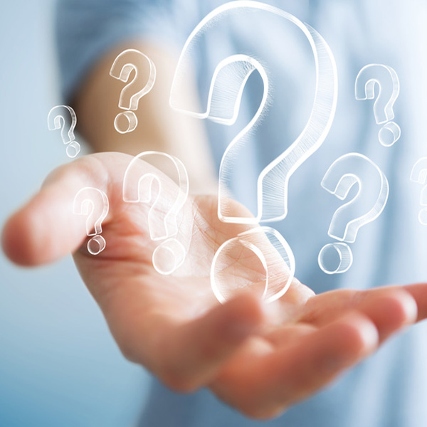 eine Hand mit vielen Fragezeichen